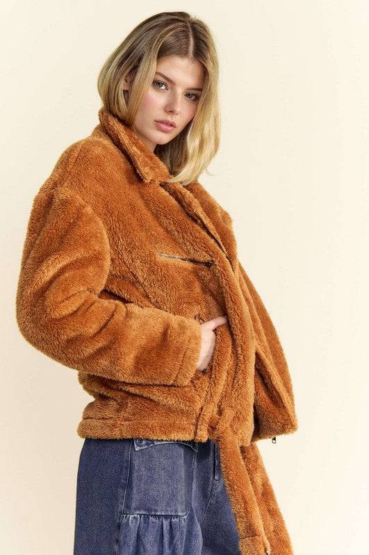 Side profile of the Davi & Dani fuzzy jacket in brown with a zip-up front and collared neck. Stylish and warm outerwear.