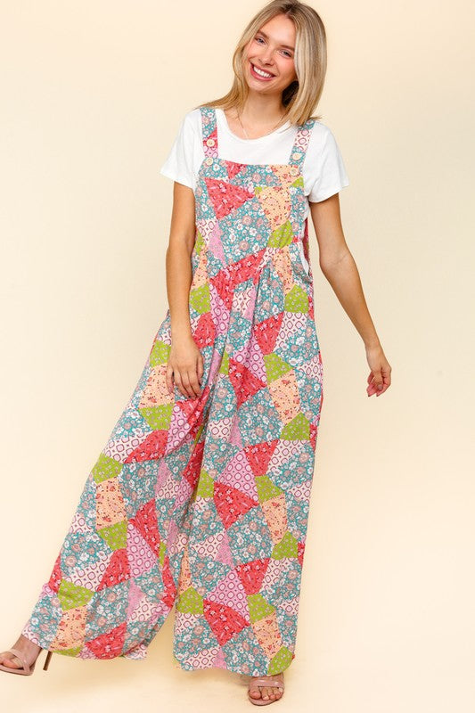 Haptics full-size printed wide-leg overalls featuring a vibrant patchwork design, styled with a white t-shirt and side pockets.