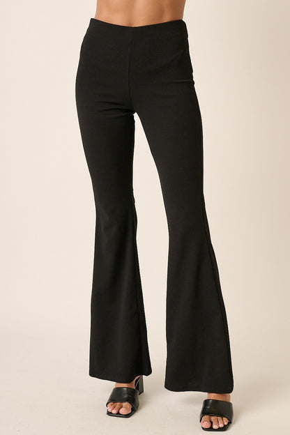 Front view of Mittoshop Crepe Knit Elastic Waist Flare Leg Pants in black, featuring a high-waisted design and flared legs.