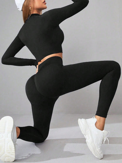 Black mock neck long sleeve top and leggings active set for yoga and workouts. High-stretch polyamide blend for comfort and flexibility.