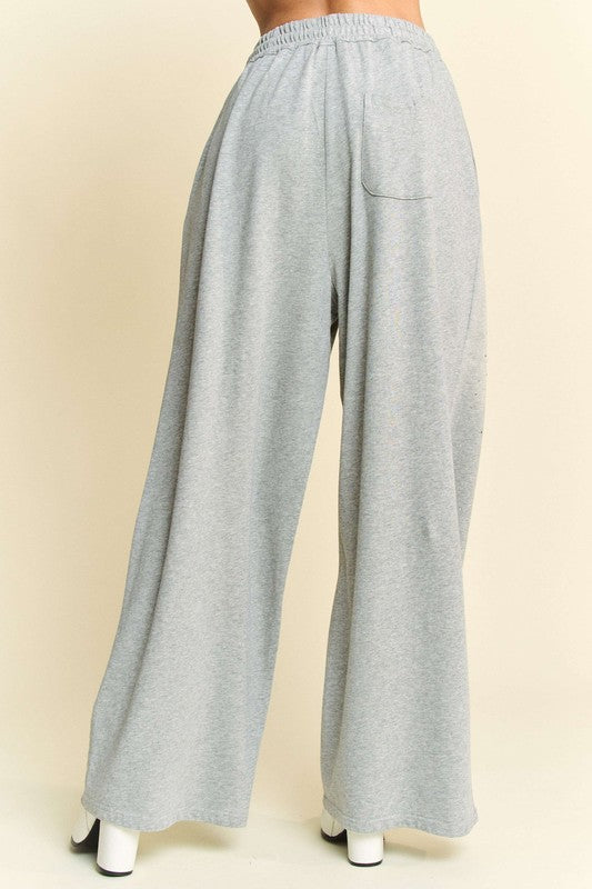 Back view of Davi & Dani Rhinestone Drawstring Wide Leg Pants in light gray, showcasing a relaxed fit with a single back pocket.