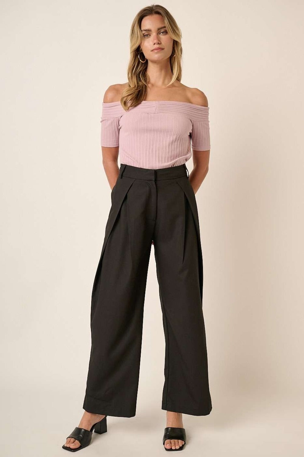 Mittoshop deep pleated high waisted wide leg pants styled with an off-shoulder pink top, showcasing a chic front view.