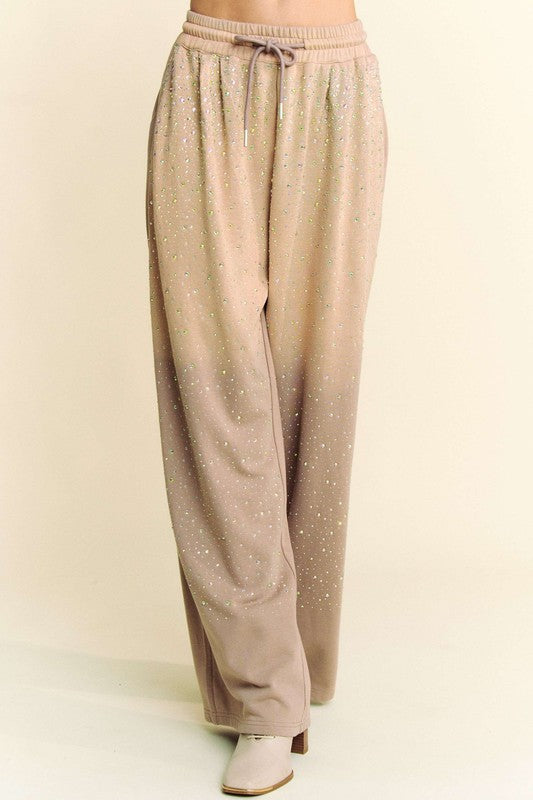 Front view of Davi & Dani rhinestone drawstring wide-leg pants in beige, with shimmering rhinestone accents and a relaxed silhouette.