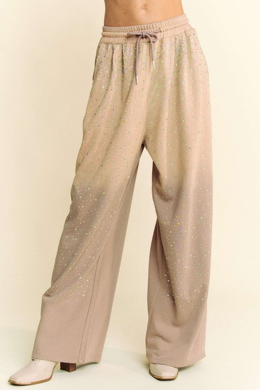 Davi & Dani rhinestone drawstring wide-leg pants in beige, featuring sparkling rhinestone details and an elastic waistband.