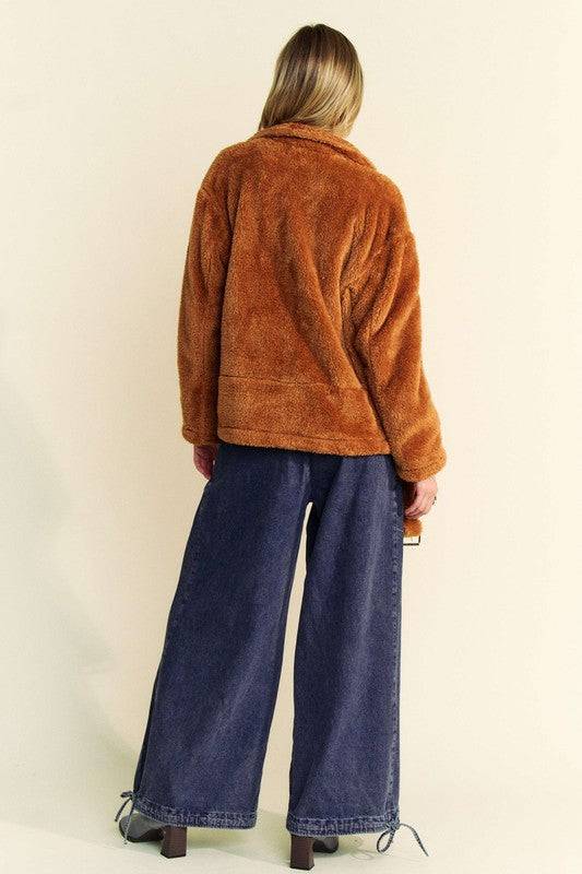 Back view of the Davi & Dani fuzzy jacket in warm brown, paired with wide-leg denim for a relaxed and cozy look.