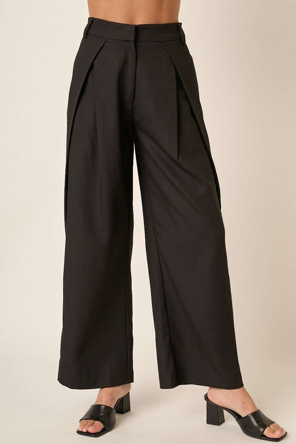 Close-up front view of Mittoshop deep pleated high waisted wide leg pants, emphasizing pleated design and wide-leg silhouette.