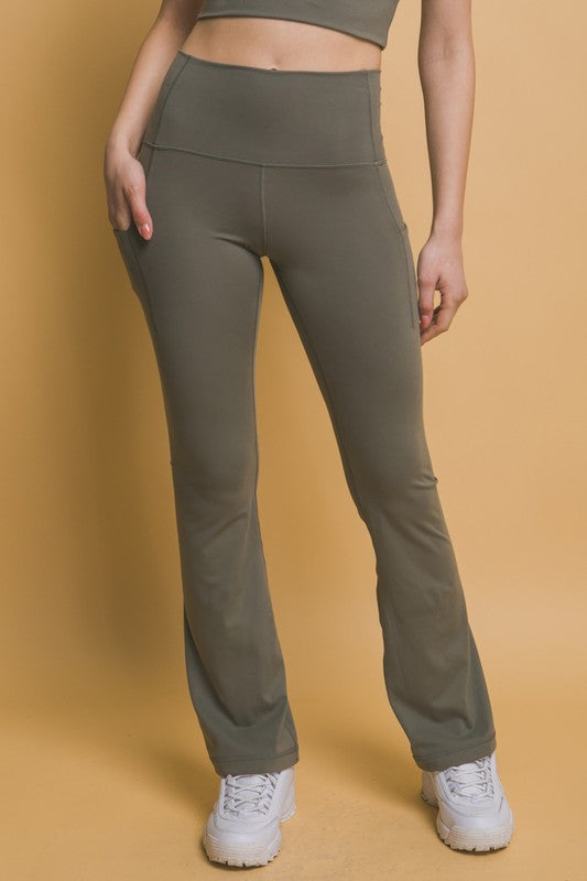 Olive green Love Tree high waist flare active leggings with side pockets, featuring a flattering fit and comfortable stretch fabric.