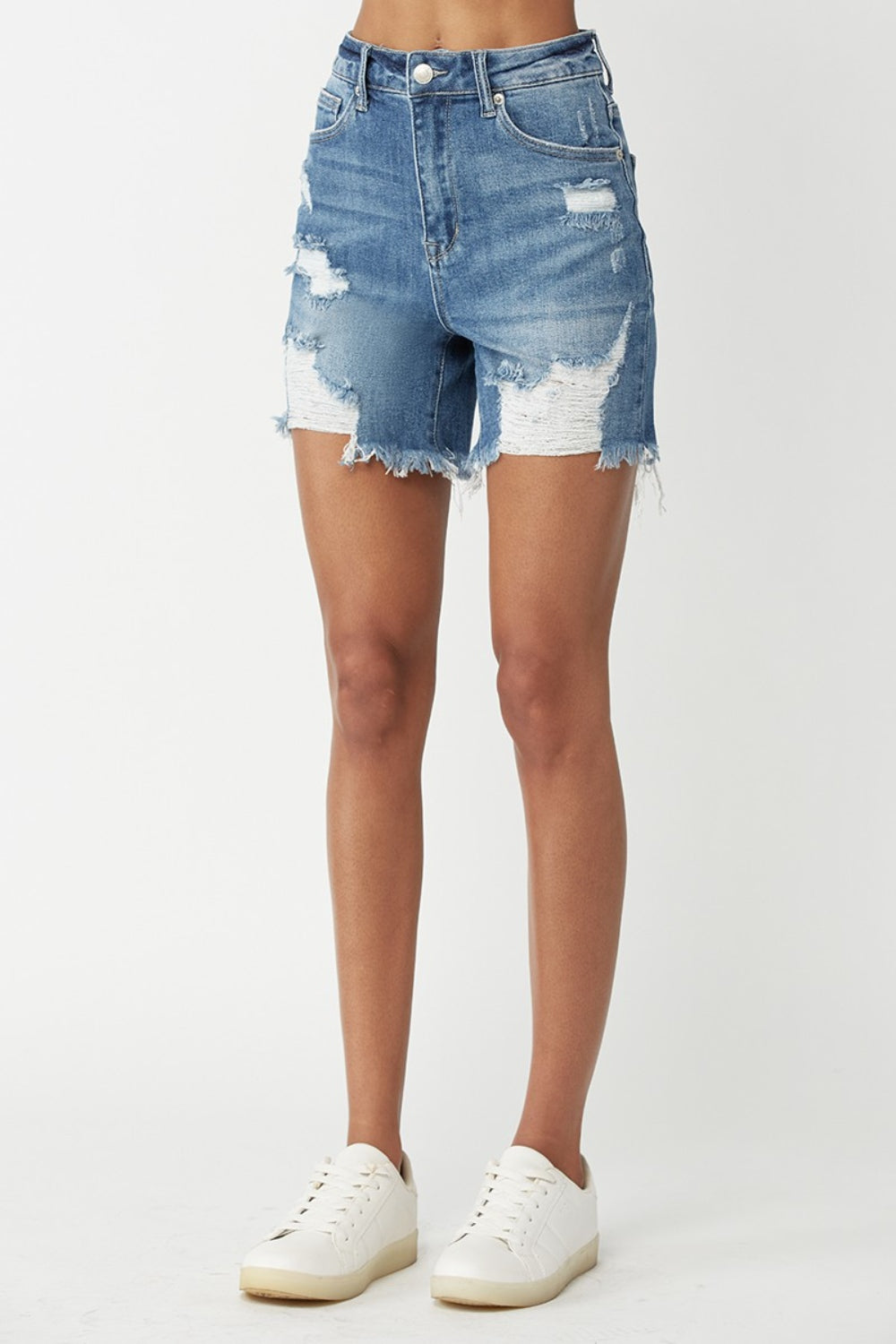 Front angle view of RISEN High Waisted Distressed Denim Shorts with ripped accents and a frayed hem, perfect for casual outfits.